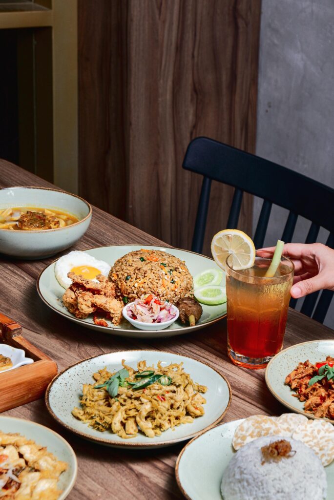Savor a variety of Indonesian dishes paired with a cold iced tea.
